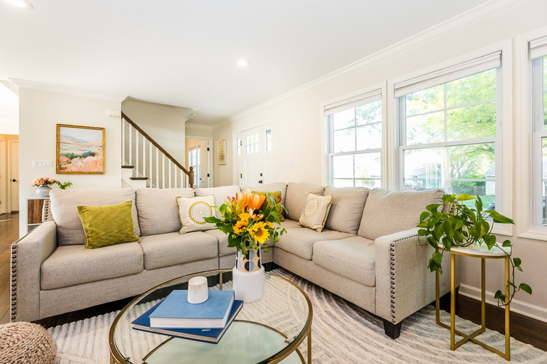 A bright, freshly staged living room by Revival House